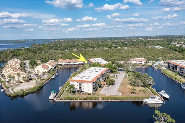 birds eye view of property with a water view