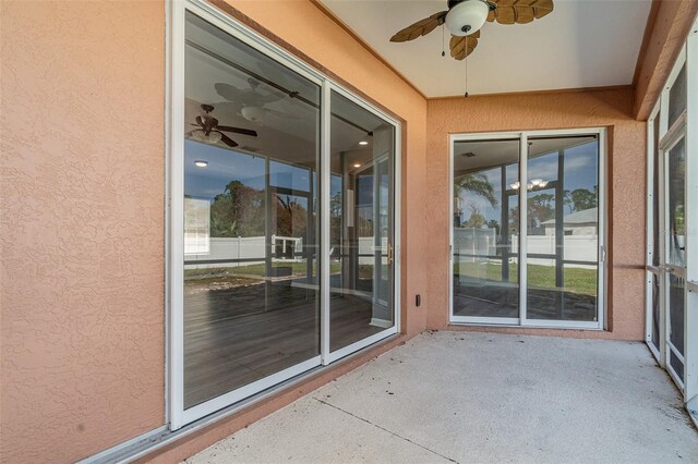 unfurnished sunroom featuring a textured wall
