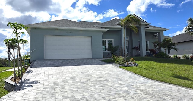 single story home featuring a front lawn and a garage