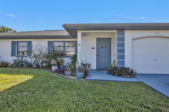 ranch-style house with a front lawn and a garage