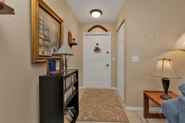 entryway with light tile patterned flooring