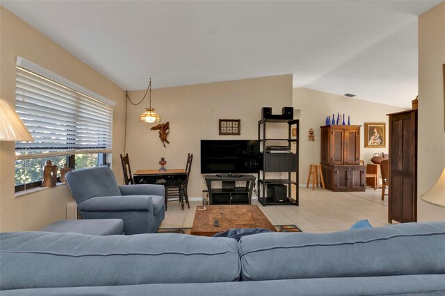 living room featuring lofted ceiling and light tile patterned flooring