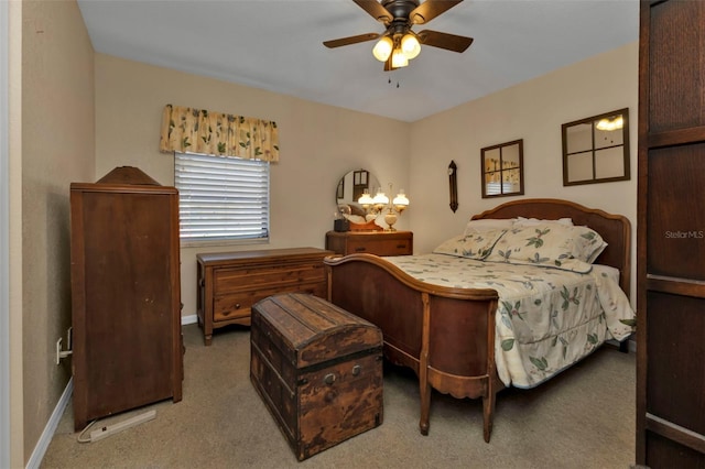 bedroom with ceiling fan and carpet floors