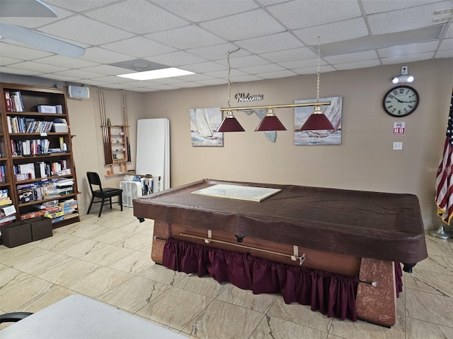 recreation room with pool table and a paneled ceiling