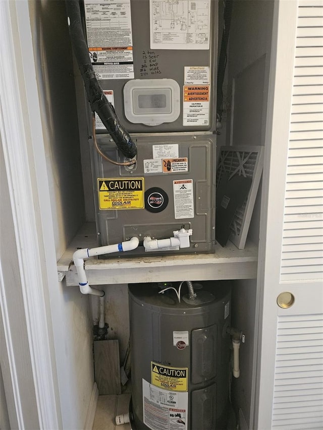 utility room with electric water heater