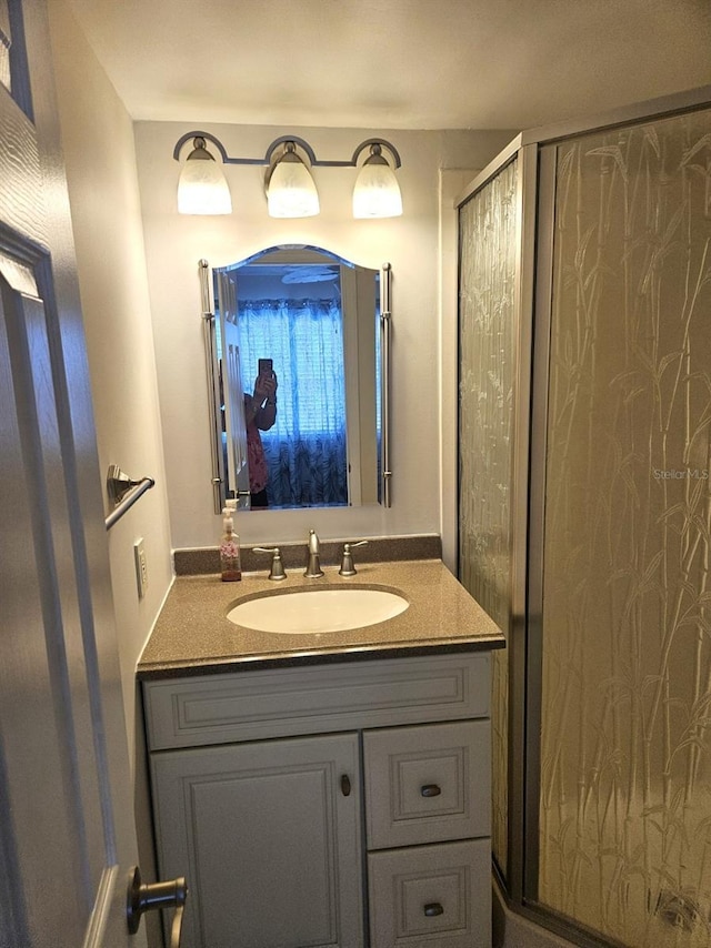 full bathroom featuring vanity and a stall shower