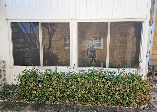 exterior details featuring brick siding