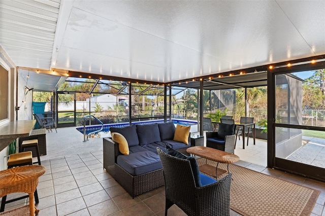 sunroom featuring lofted ceiling