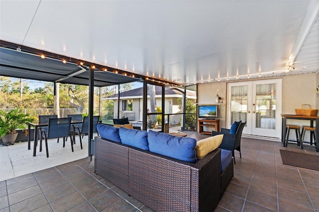 sunroom featuring french doors