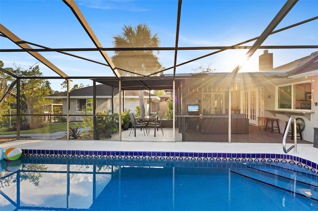 view of pool featuring a patio area and a lanai