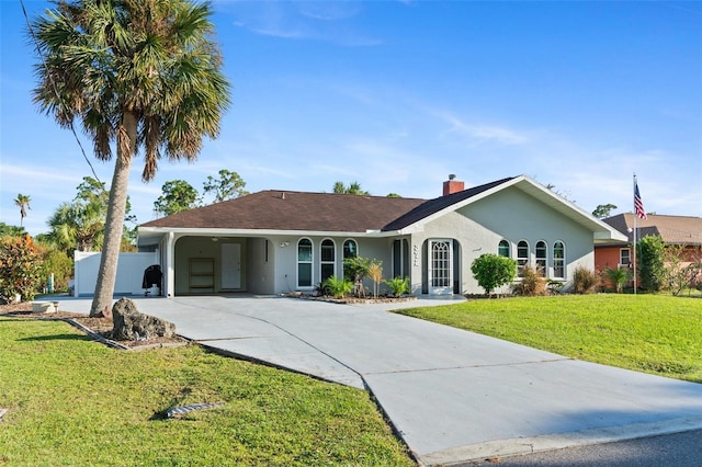 single story home featuring a front lawn and a carport