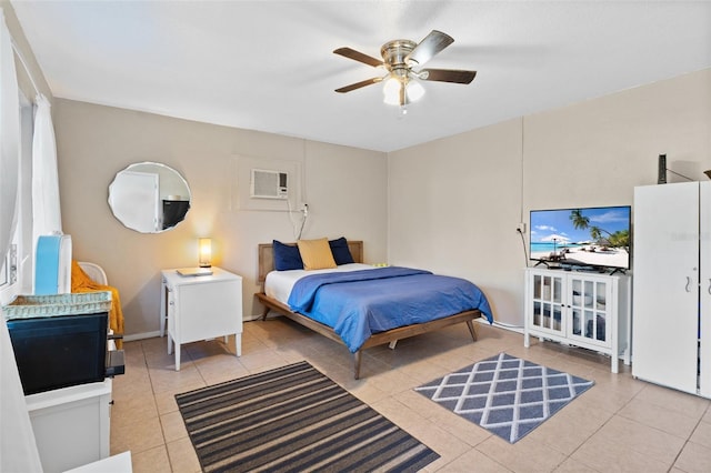 bedroom with a wall unit AC, light tile patterned floors, and ceiling fan