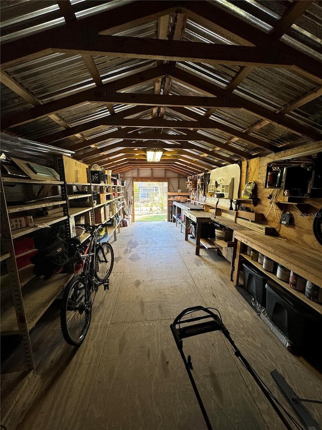 misc room featuring a workshop area and vaulted ceiling