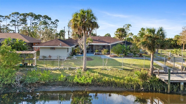 back of property with a water view