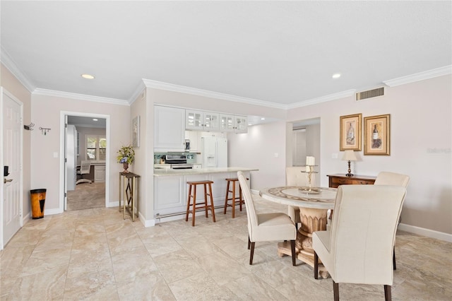 dining area featuring ornamental molding