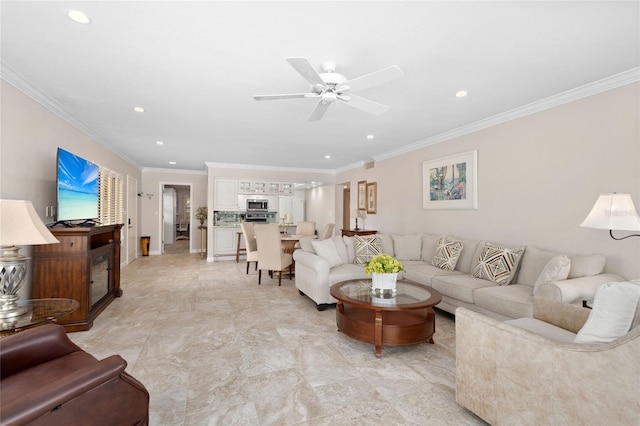 living room featuring crown molding and ceiling fan