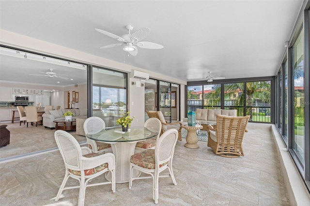 sunroom with ceiling fan and plenty of natural light