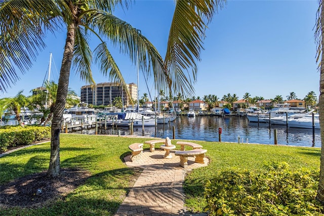 dock area featuring a yard and a water view