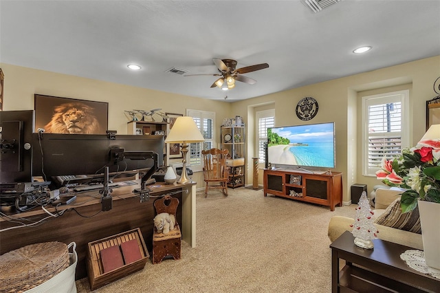 carpeted home office with ceiling fan