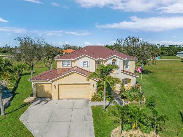 mediterranean / spanish-style home with a front yard and a garage