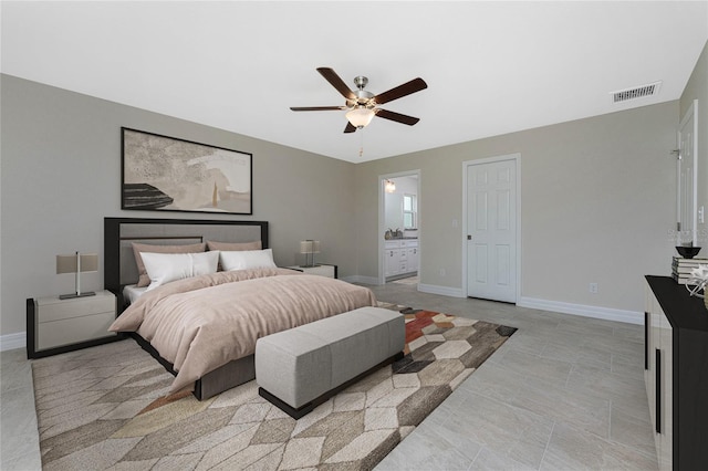 bedroom featuring ensuite bath and ceiling fan