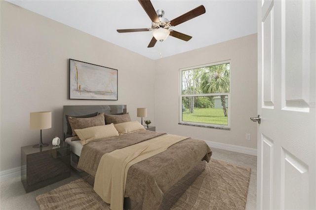 bedroom with light carpet and ceiling fan