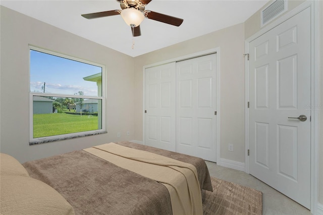 bedroom with light carpet, a closet, and ceiling fan