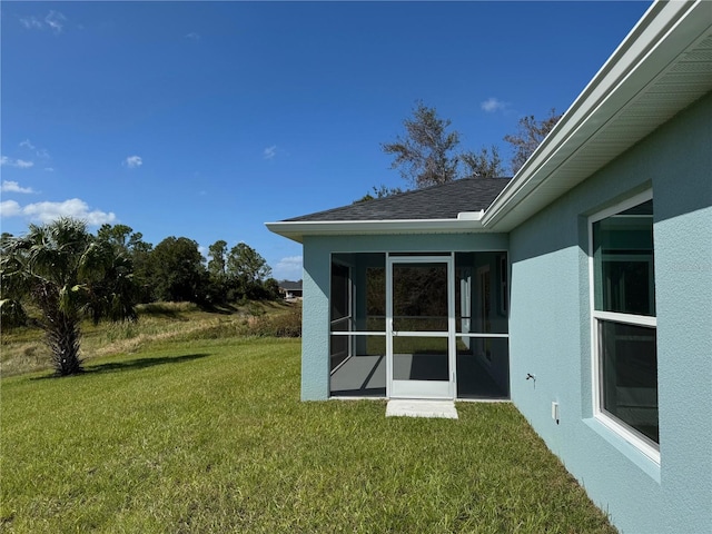 view of yard with a sunroom