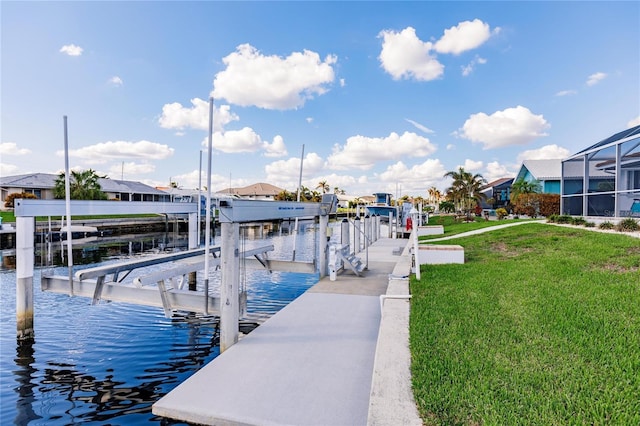 view of dock featuring a water view, a lawn, and a lanai