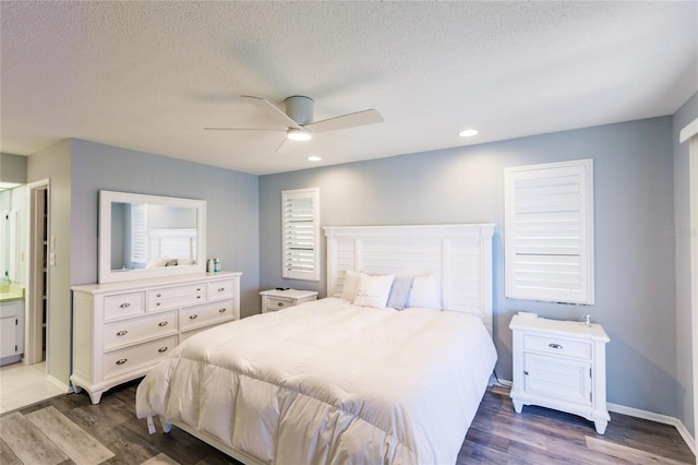 bedroom featuring ceiling fan, a textured ceiling, and dark hardwood / wood-style flooring