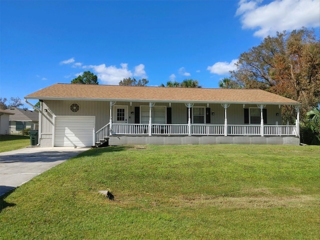 ranch-style home with a front yard, a porch, and a garage