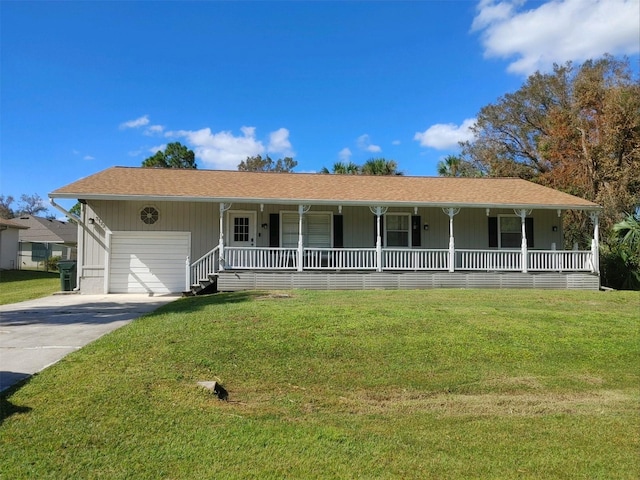 3173 S Cranberry Blvd, North Port, FL 34286 - ranch-style house with a porch, a front lawn, and concrete driveway