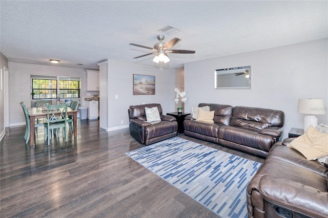 3173 S Cranberry Blvd, North Port, FL 34286 - living area featuring dark wood finished floors, a ceiling fan, a textured ceiling, and baseboards