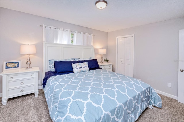 carpeted bedroom featuring a closet