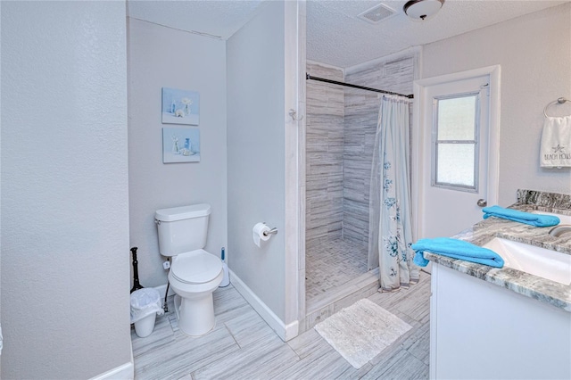 3173 S Cranberry Blvd, North Port, FL 34286 - full bath with toilet, a stall shower, baseboards, vanity, and a textured ceiling