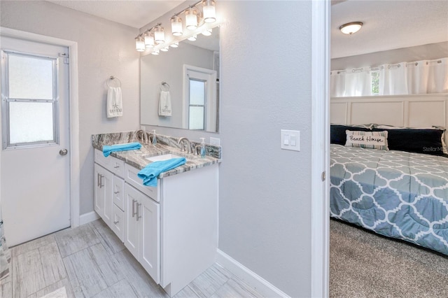 3173 S Cranberry Blvd, North Port, FL 34286 - ensuite bathroom featuring double vanity and baseboards