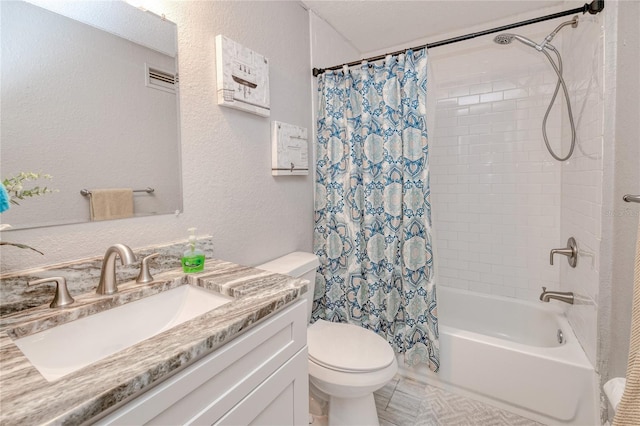 full bathroom featuring vanity, shower / tub combo with curtain, and toilet