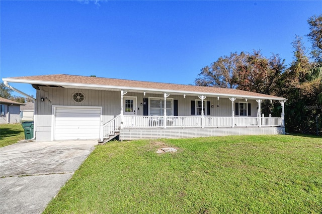 ranch-style house with a front yard, a garage, and a porch