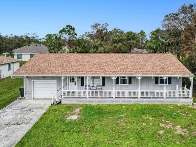 ranch-style house with a porch, a front yard, and a garage