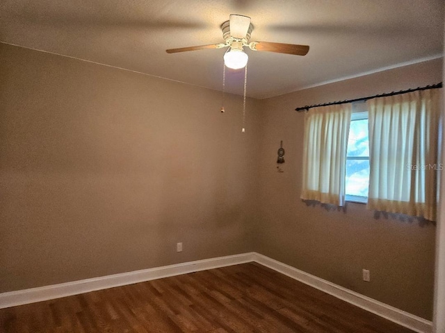 unfurnished room featuring hardwood / wood-style flooring and ceiling fan