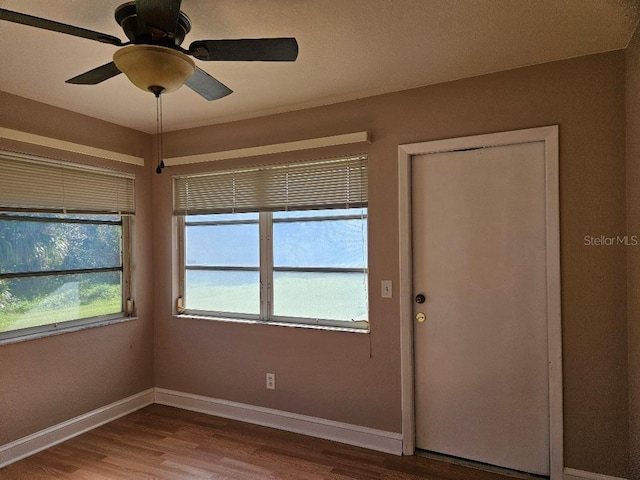 interior space with hardwood / wood-style flooring and ceiling fan