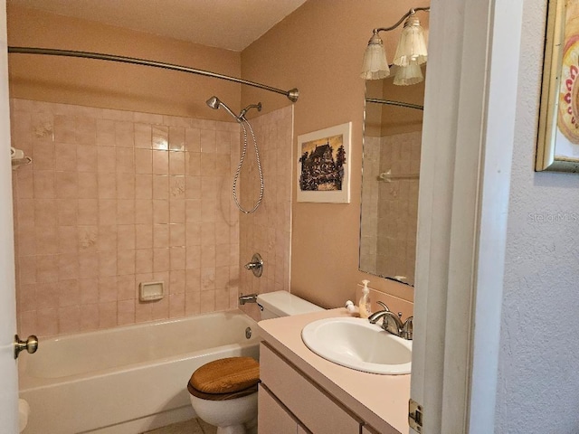 full bathroom with vanity, toilet, and tiled shower / bath