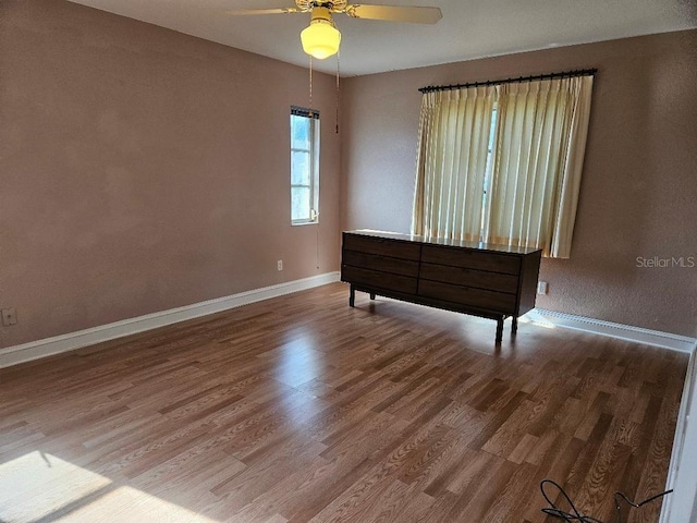 unfurnished bedroom with hardwood / wood-style flooring and ceiling fan