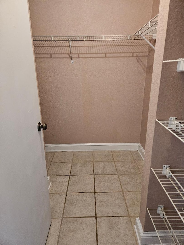 walk in closet featuring tile patterned floors