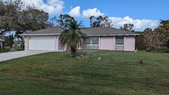 ranch-style home with a garage and a front yard