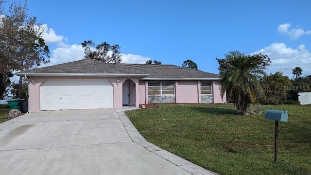 single story home featuring a garage and a front yard