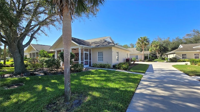 ranch-style home with a front lawn