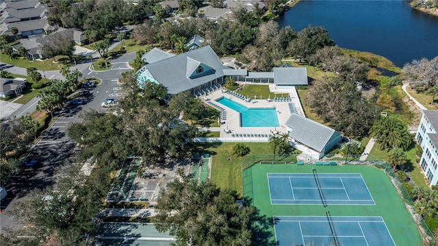 birds eye view of property with a water view