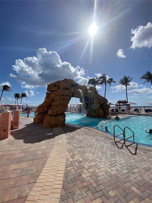 view of pool featuring pool water feature