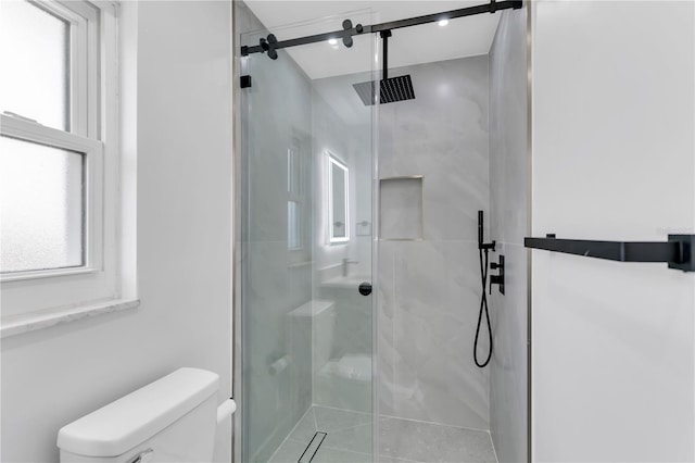 bathroom with toilet, tile patterned flooring, and an enclosed shower